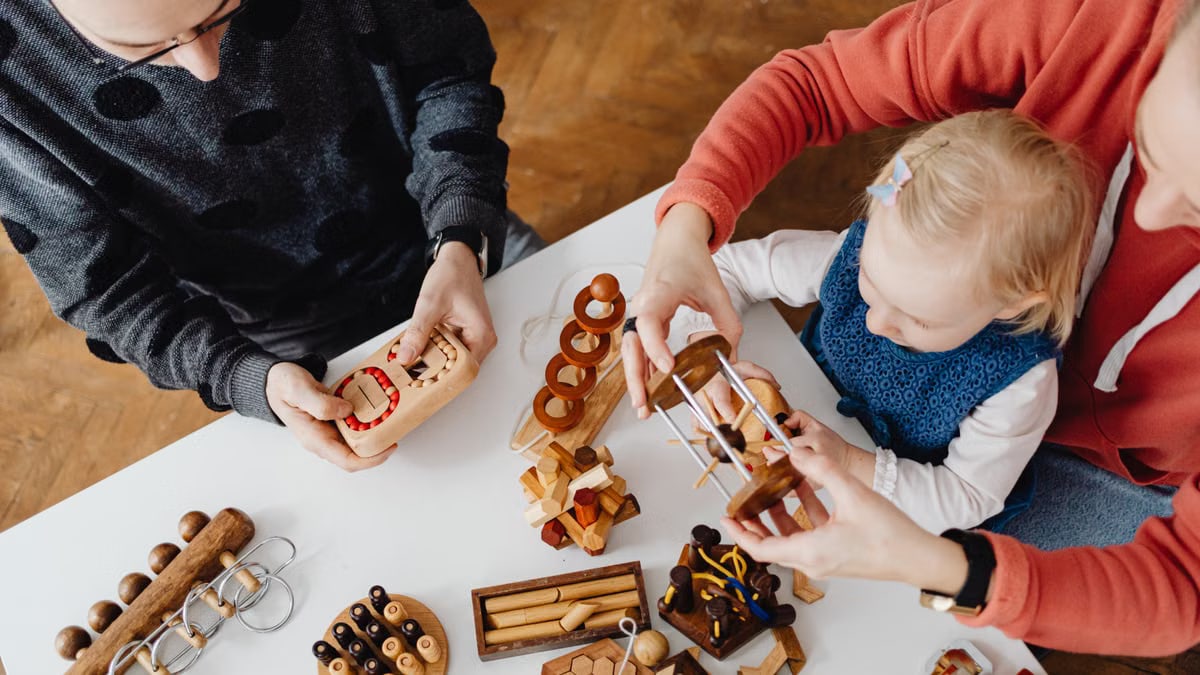 Family engaging in educational play with wooden puzzles. Perfect for learning and bonding.
